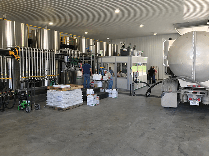 Truck being loaded in the new liquids building in Circle R, Illinois.