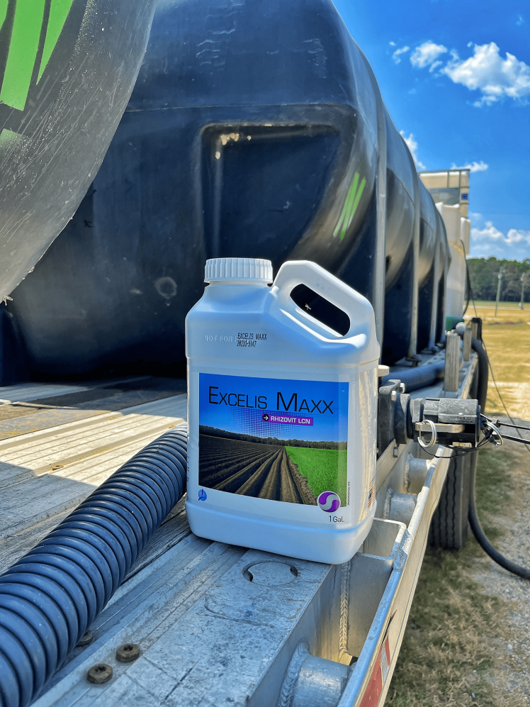 EXCELIS MAXX nitrogen stabilizer jug in the field.